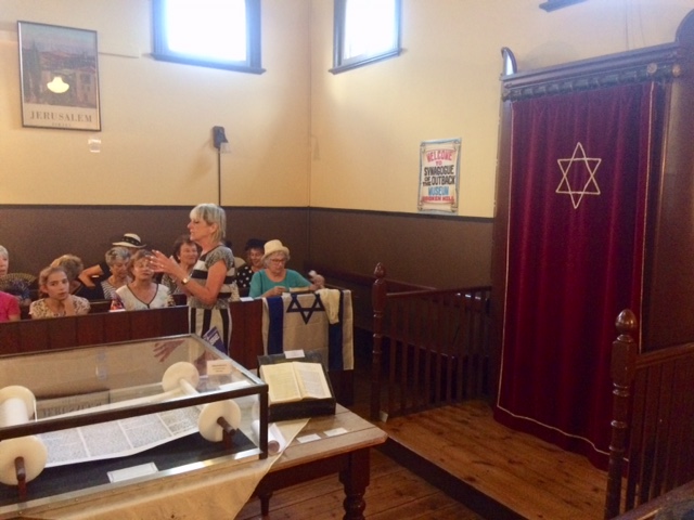 Women from the Ark Centre in Melbourne sitting in the womens' section of the Broken Hill Synagogue